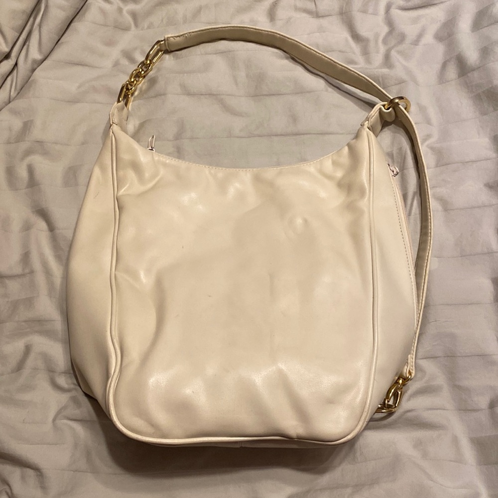 Large off white vintage purse. Leather with gold accents.